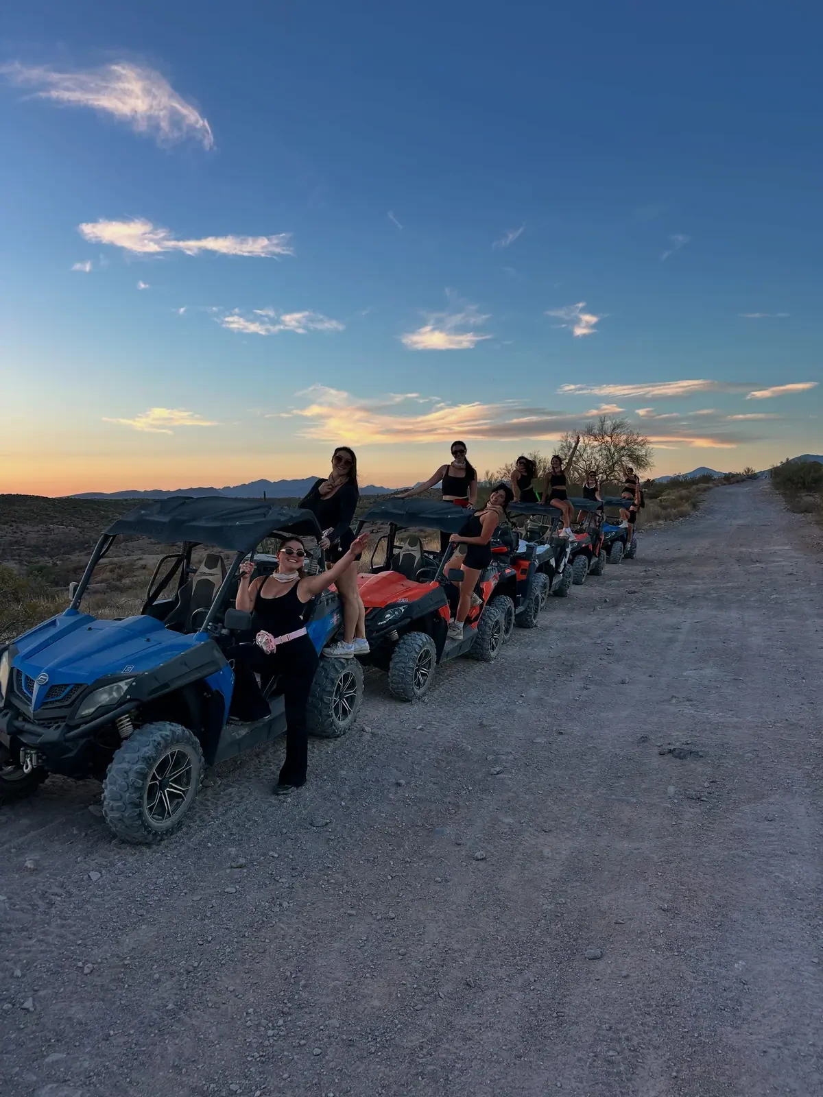 Buggies and riders lined up as dusk settles over the Sonoran Desert